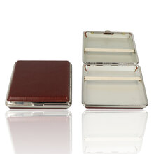 A picture of 2 cigarette cases, one is closed showing the leather effect finish and one is open showing the elasticated clasp inside.