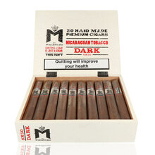 An open white box containing 20 Macanudo Dark cigars wrapped in cellophane