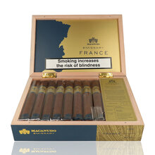Open presentation box of 16 Macanudo Emissary France Toro cigars with branded interior, blend information card and individually cellophaned cigars.